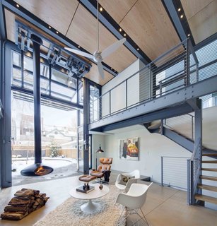 The polished concrete floor resembles the limestone pavers on the exterior, enhancing the continuous connection between inside and outside.