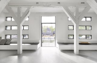 Existing, renovated windows provide ample daylight and views of the surrounding shipyard. 