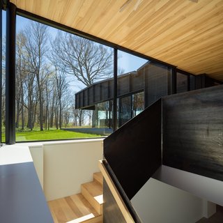 A Dramatic Cantilevered Roof Creates a Spacious Terrace Overlooking Lake Michigan - Photo 8 of 11 -