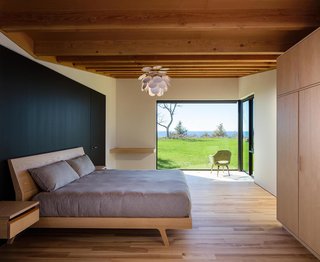 A Dramatic Cantilevered Roof Creates a Spacious Terrace Overlooking Lake Michigan - Photo 9 of 11 - The master suite has a large corner window that creates a private, interior terrace for enjoying the natural landscape. 