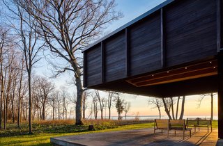 A Dramatic Cantilevered Roof Creates a Spacious Terrace Overlooking Lake Michigan - Photo 10 of 11 - The dramatic cantilever provides shade and protection, while leaving views to the lake plentiful. 