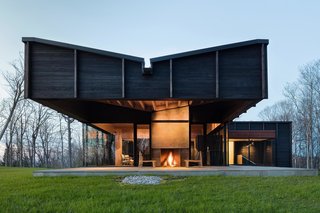A Dramatic Cantilevered Roof Creates a Spacious Terrace Overlooking Lake Michigan - Photo 11 of 11 - The exterior terrace is complete with an integral fireplace. 