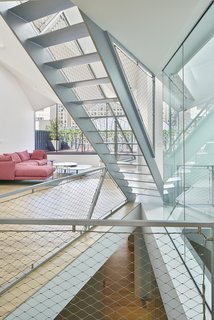 A Hidden Penthouse Sits Atop a Historic Cast-Iron Building in New York - Photo 13 of 16 - The penthouse space extends across three floors, creating a unique urban form of living with integral vertical circulation. 