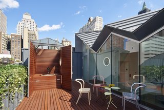 A Hidden Penthouse Sits Atop a Historic Cast-Iron Building in New York - Photo 15 of 16 - The former elevator bulkhead has been repurposed into a hot tub. 