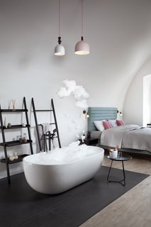 A Stylish Hostel in a Historic Czech Fortress Starts at $16 a Night - Photo 3 of 19 - The deluxe "Big One" is a luxurious escape, complete with a freestanding tub and heated floors.