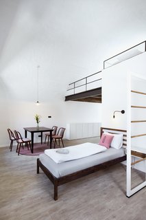 A Stylish Hostel in a Historic Czech Fortress Starts at $16 a Night - Photo 10 of 19 - The Girls' Choice, a six-bed dorm, is complete with a custom built mezzanine floor. 
