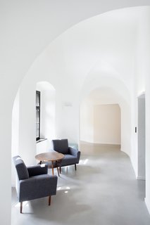 A Stylish Hostel in a Historic Czech Fortress Starts at $16 a Night - Photo 12 of 19 - Informal lounge spaces along the arched corridor provide ample opportunities for interaction between travelers. 