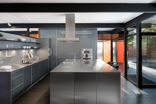 An Award-Winning Midcentury Residence in Los Angeles County Asks $3.9M - Photo 4 of 17 - The kitchen, centrally located as the center of activity in the plan, acts as a hinge space, separating the more formal living and dining spaces from the more casual pool and family room. 