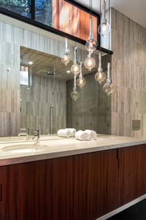 An Award-Winning Midcentury Residence in Los Angeles County Asks $3.9M - Photo 13 of 17 - Suspended pendants create a sculptural interest in the bath. 