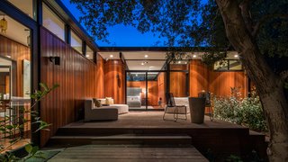 An Award-Winning Midcentury Residence in Los Angeles County Asks $3.9M - Photo 16 of 17 - Transom windows and full-height glazing provide seamless connections between interior and exterior spaces. 