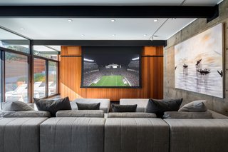 An Award-Winning Midcentury Residence in Los Angeles County Asks $3.9M - Photo 12 of 17 - A drop-down projection screen provides plentiful entertainment options. 