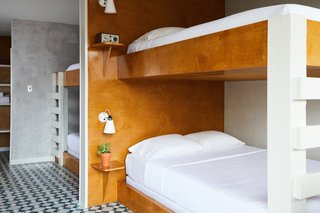 The bunk room, located on the first floor, has direct pool access. Custom built-in bunk beds provide the perfect accommodations for a group of friends. 