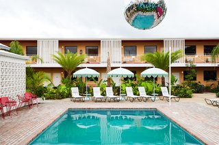 A cantilevered disco ball hangs over the courtyard pool, while guest room balconies overlook the shared communal space. What was previously a concrete parking lot has been transformed into a lush, tropical courtyard. 