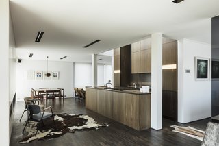 Bog oak wood cabinets fill the kitchen space. 