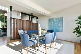 The formal dining room is framed by a wood screen wall which allows light to continually pass inward. 