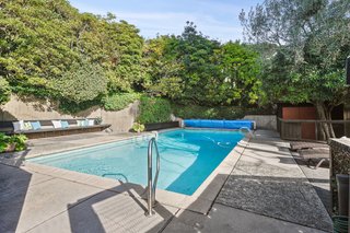 A solar heated pool is one of the many modern amenities that add to the iconic estate.