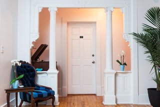 Forget Coworking—These Coliving Spaces Let You Travel the World For $1,800 a Month - Photo 5 of 25 - Roam Miami Blue House living room