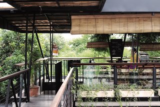 Forget Coworking—These Coliving Spaces Let You Travel the World For $1,800 a Month - Photo 9 of 25 - Roam Bali rooftop