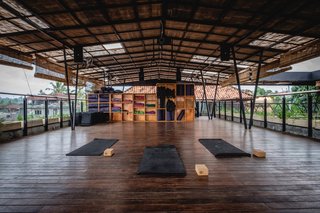 Forget Coworking—These Coliving Spaces Let You Travel the World For $1,800 a Month - Photo 10 of 25 - Roam Bali open-air yoga deck