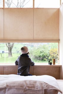 A built-in ledge set directly at the window provides a desk surface.