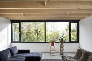 A Mason Corbeil Sofa provides the perfect lounge setting to relax and enjoy the views of the treetops.