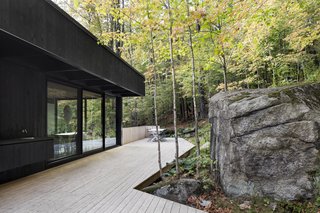 The exterior deck gracefully meanders its way around the rock formations.