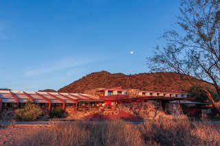 Rich red hues and earthy sandy tones create a close relationship between the buildings and the landscape.
