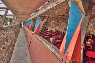 The Cabaret Theater is an open-air venue, blending exterior and interior spaces. The low roof overhang protects visitors from the harsh desert sun.