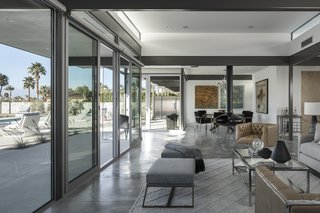 Full-height glazing and continuous material use allow spaces to flow freely from one to the other, and from inside to outside.