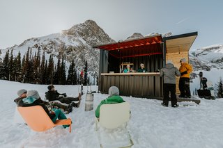 Outdoor enthusiasts gather at the bar for a quick drink.