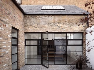 Operable doors and windows provide fresh air ventilation off a newly created courtyard space.