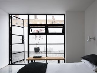 An interior courtyard is accessible from the bedroom, providing an unexpected secluded oasis.