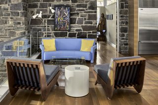 The furniture is a mixture of authentic vintage pieces, collected over many years; custom-built pieces; and iconic designer creations.