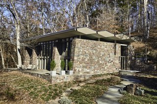 The roof, which appears to float above the heavy stone walls, tilts slightly upward along the southwestern facade, creating the ideal design for passive solar heating.