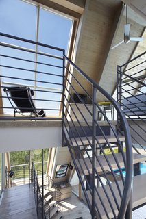A framed view is provided atop each turn of the staircase.