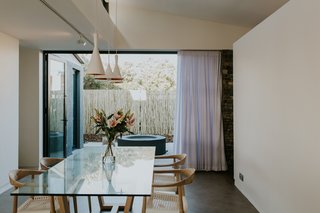 A fire pit and small courtyard lie directly adjacent to the dining space.