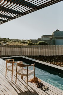 The home opens up to, and connects with, the surrounding neighborhood.