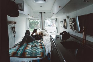 To break up the white tones inside the van, Lexi and Cody decided to paint the kitchen black. The kitchen included a black galaxy granite countertop, as well as a black refrigerator.
