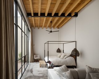 The furnishings and fixtures have all been selected with the notion of relaxation in mind. Natural materials, soft textiles, and neutral colors continue the muted palette of the construction.