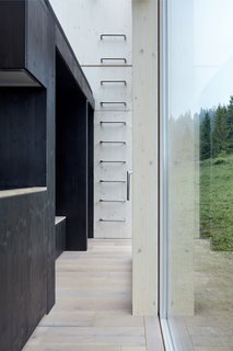 A built-in ladder ascends to the elevated sleeping area.