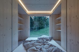 On one end of the home lies a sleeping area with built-in storage.