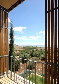 Private balconies provide unobstructed views of the surrounding landscape from each bedroom.