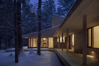 On the south, a deep overhang protects the living room from the summer sun, while providing coverage to the outdoor elements.
