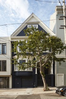 This dark-blue 1907 home appears to be typical of the Victorian character that was evident in early 1900's residential architecture. Unbeknownst from the outside are the bright, light-filled interiors and modern interventions.