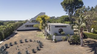 A lavender and rose garden fills part of the two-acre estate. 1.5 acres remain usable, providing the opportunity for expansion, a swimming pool, or whatever the next owner may dream up.