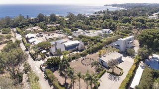 An aerial view of the home and dramatic ocean vistas in Malibu.