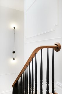 The revamped staircase blends traditional and modern.