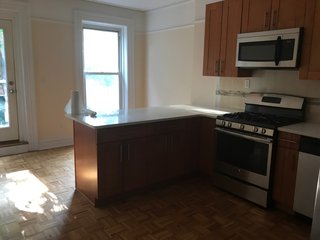 The kitchen cabinets were relatively new and in decent shape. The designers were able to keep the cabinets and appliances, providing finish updates elsewhere to help elevate the kitchen to a contemporary space.