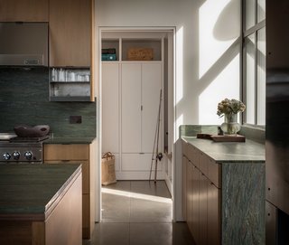 The soapstone counters and back splash resonate with the natural setting, drawing in hues and colors from the surrounding landscape.