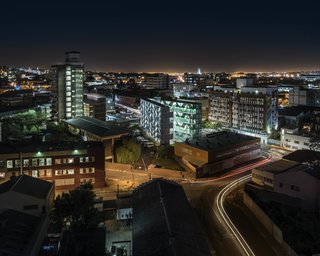 The residential building blends in with the urban fabric.